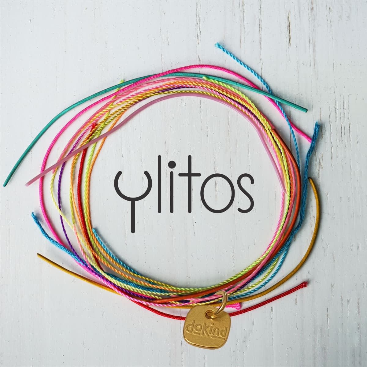 Colorful Ylitos custom jewelry with cords and gold charm